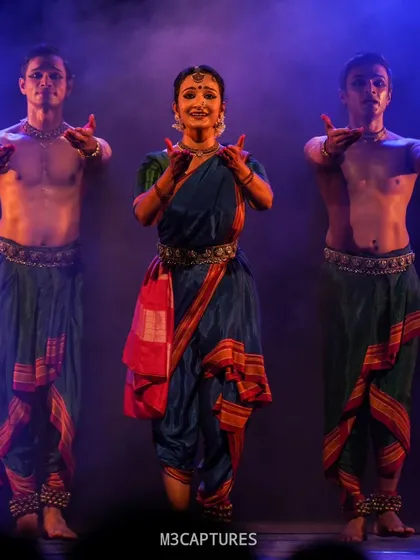The cast of 'Nagamandala' in a powerful group pose. The use of smoke and colored lighting here helps to build a specific mood, transforming the stage into another world.