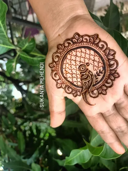 A simple mandala design featuring a bird motif in the center. This is a quick and beautiful option for any casual occasion.
