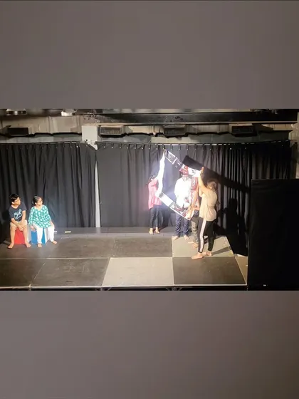 A wide shot of the stage during a children's play, which was scripted, directed, and designed entirely by the kids themselves.