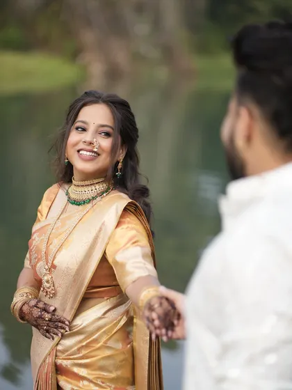 Capturing the joy of an engagement. For this special moment, I provided saree pre-pleating to ensure the bride-to-be's golden silk saree looked absolutely perfect and stayed in place for her entire celebration.