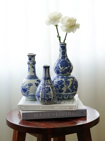 A collection of our product photography for various home decor and tableware brands. These shots display a range of items including placemats, table runners, ceramic bowls, plates, vases, bar tools, and candles, all styled to perfection.