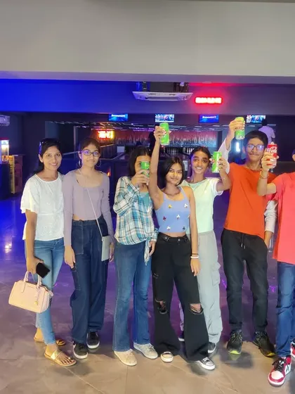 Cheers to another year. A group of friends enjoying drinks and good times during a birthday hangout at our New BEL Road location.