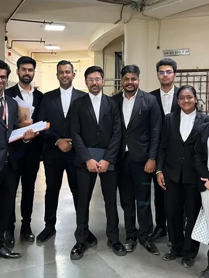 In the corridors of justice. My team and I, ready with our case files, navigating the court system to protect our clients' interests.