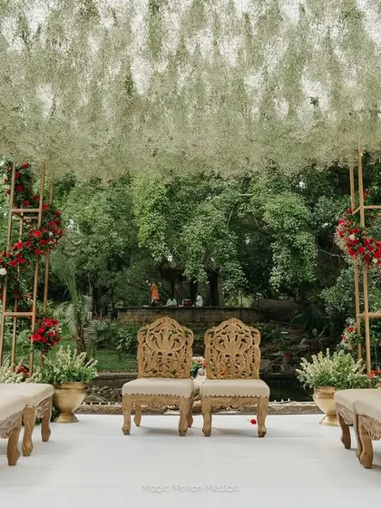 A breathtaking mandap setup at our Pond Pavilion, featuring a canopy of baby's breath and elegant seating. This showcases how our spaces can be customized for your dream wedding ceremony.