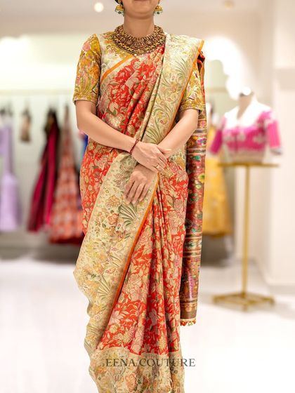My client Harshitha radiates pure elegance in this stunning ensemble. I paired a vibrant, floral Banarasi silk saree with a custom blouse featuring multi-colored thread embroidery that perfectly picks up the hues in the saree.
