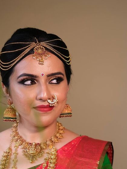 A close-up of Chinmayi's muhurtham makeup, showcasing the sharp winged eyeliner and flawless base that defines a classic South Indian bridal look.