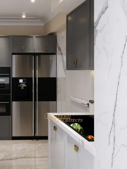 The design ensures every inch is functional. This view highlights the tall unit with a built-in oven and a side-by-side refrigerator, demonstrating our approach to smart, space-saving kitchen layouts.