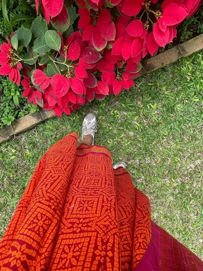 We believe in giving beautiful textiles a second life. This image showcases our overprinting service, where we take a pre-loved vintage Kanjeevaram silk saree from our founder's personal collection and refresh it with a vintage 'chunadi' block print.