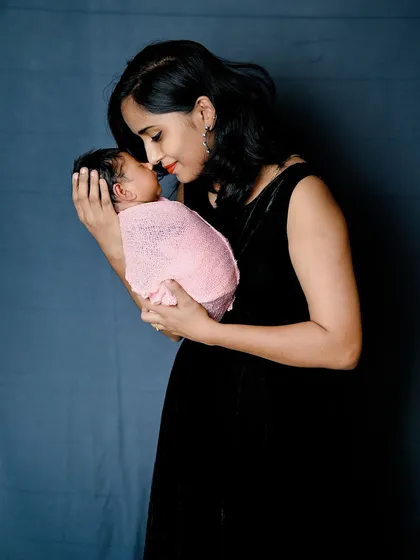 A mother's gentle love. This tender moment between a mom and her newborn is what family photography is all about.