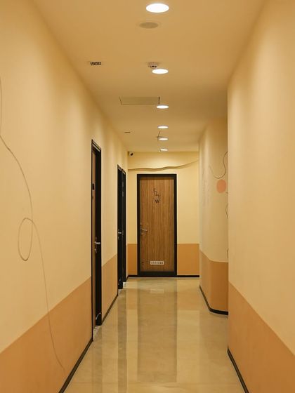 The clean and modern hallway leading to our treatment rooms in the Noida clinic.
