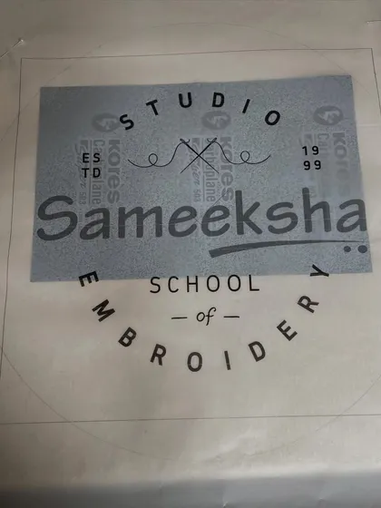 I finally decided to hand-embroider my own studio logo. This image shows the tracing on the fabric, ready to be stitched.