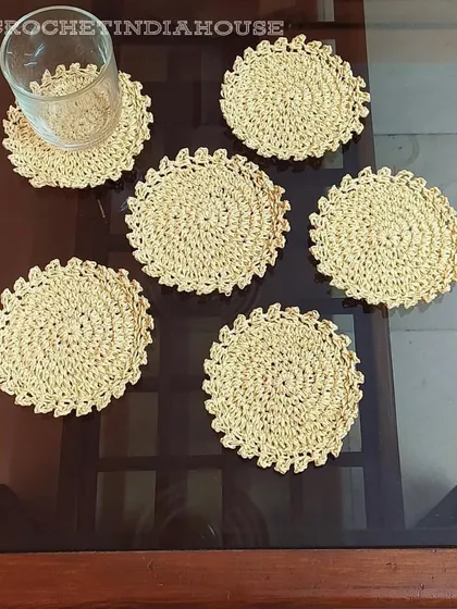 These handmade crochet coasters in a neutral beige color are perfect for any decor style and add a touch of rustic charm to your table.
