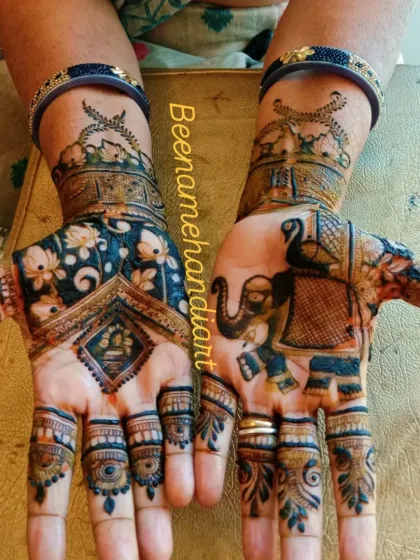 A beautiful design with elephants and peacocks inside ornate frames, a very royal and traditional look.