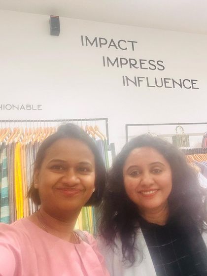 A great moment with a client at my Indyvarna boutique. The words on the wall behind us say it all: Impact, Impress, Influence. That is the goal of my personal branding and image consulting work.