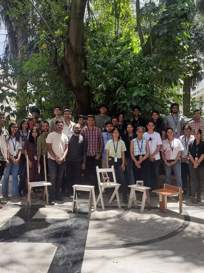 The entire group from the BMS College of Architecture workshop, with the furniture pieces they created.