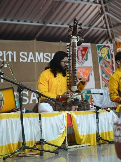 A wider view of our performance in Pune, featuring a wonderful ensemble of musicians on sitar, guitar, and keyboard, creating a rich musical tapestry.