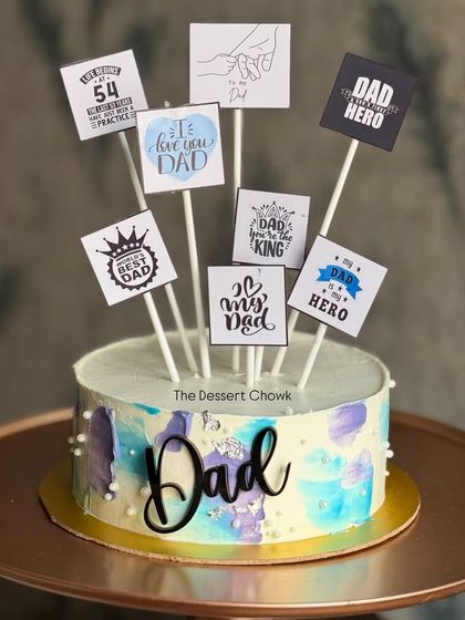 A thoughtful cake for Dad, decorated with multiple toppers expressing love and appreciation.