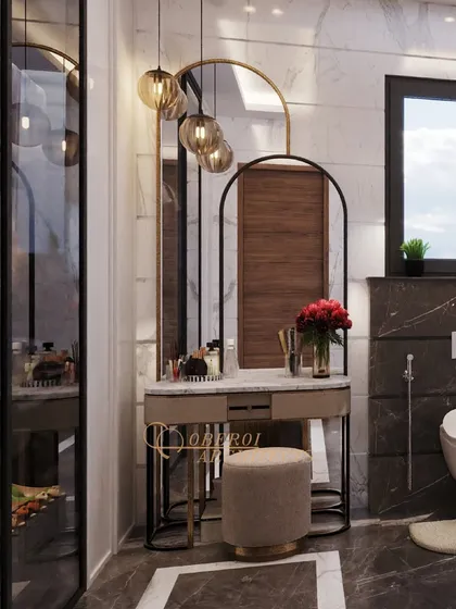 This bathroom features a dedicated dressing and grooming zone, with a stylish vanity table, arched mirrors, and elegant pendant lighting.