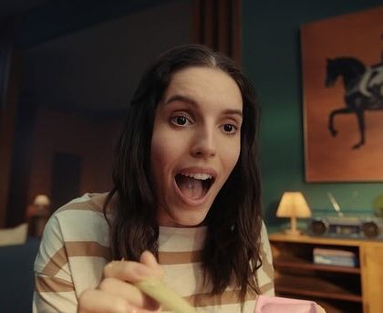 The moment of relief and joy. Her simple outfit remains the same, but her expression changes everything, showing the service's impact.