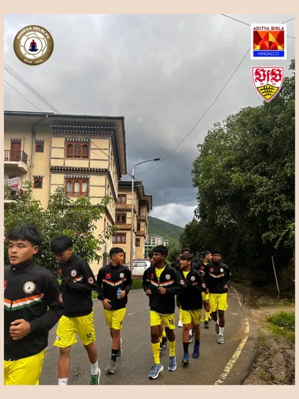 The team moves as one unit during a training run in Bhutan. The unique architecture of the region provides a stunning background for our work, reminding us of the diverse cultures we get to experience.
