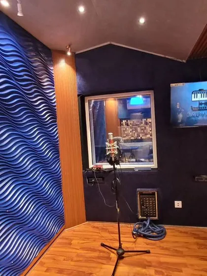 Our dedicated vocal recording booth is designed for pristine sound. The acoustic treatment, including the 3D wave wall, ensures your voice is captured with perfect clarity, free from any outside noise.
