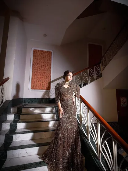 Another angle of this stunning campaign look. The architectural background adds to the modern and sophisticated feel of the entire ensemble.