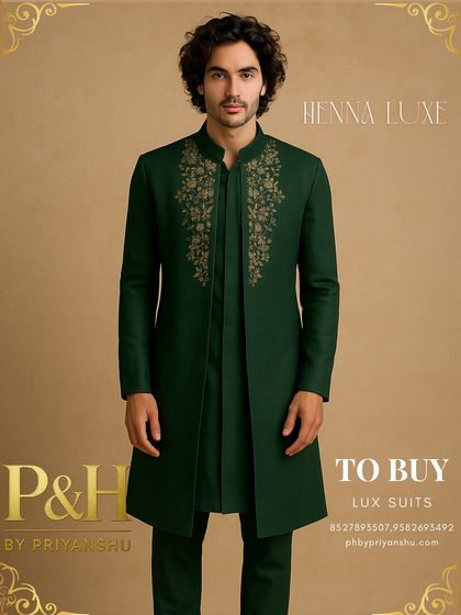 This dark green Indo-Western jacket with a front-open kurta is a sophisticated choice for a Sangeet night. The golden floral embroidery on the chest adds a touch of regal elegance.