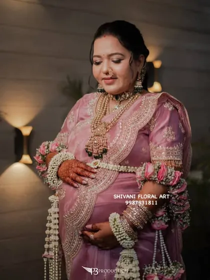 For moms-to-be who want a grand and royal look, I design heavy floral kalire like these. Made with beautiful pink roses and Tagar buds, they pair perfectly with a matching floral shela to create a look full of grace and splendor.