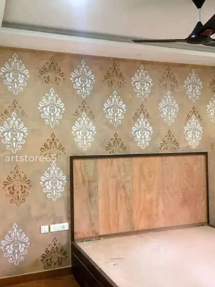 For this bedroom, we applied a classic damask stencil over a warm, earthy-toned texture. The alternating silver and bronze patterns create a timeless and regal atmosphere, perfect for creating a restful and elegant personal space.