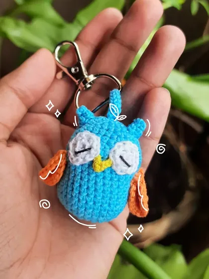Here's the sleepy owl as a keychain. It's a perfect, wise little buddy to hang on your bag or keys.