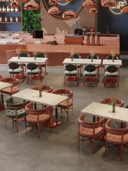 Another overhead view showing different seating arrangements, including chairs with pink and teal upholstery that complement the copper accents.