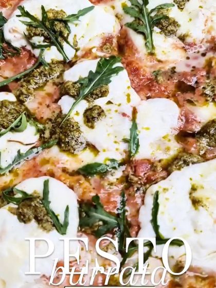 A close-up macro shot of my Pesto Burrata pizza. This image highlights the delicious combination of creamy cheese, fresh arugula, and vibrant pesto.
