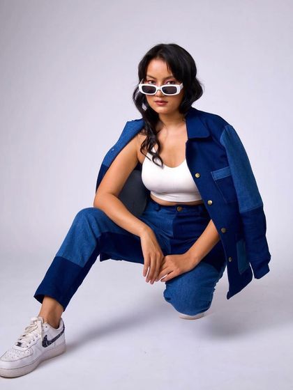 Another shot of the denim look, showing off the clean makeup and effortless hair from a different angle.