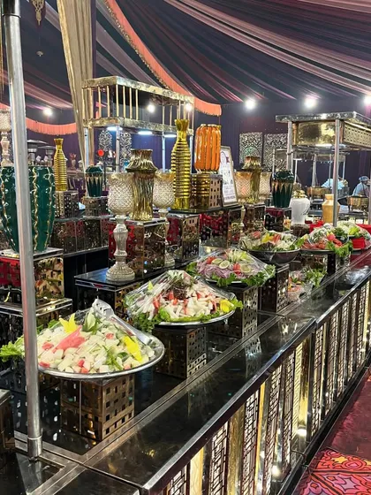 Beyond sweets, my cold stations include a variety of fresh and vibrant salads. This counter showcases several salad options presented in elegant bowls, offering a light and healthy choice for guests.