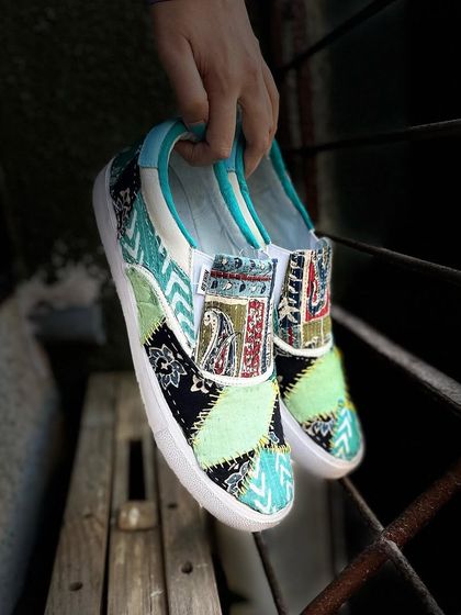 Something a little different: patchwork slides. I used different pieces of cotton fabric, including traditional Indian Ajrakh and Kalamkari prints, and stitched them onto suede slides for a unique, bohemian look.