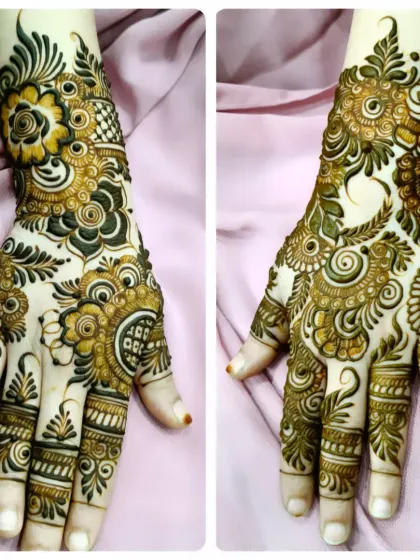 A split view showing both the front and back of this gorgeous floral design. The patterns are bold and artistic, making a beautiful statement on the hands.