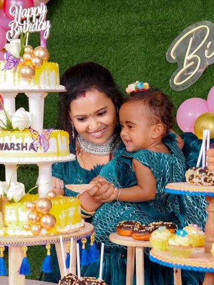 A thrilling 'PJ Masks' themed birthday party, with character cutouts, a cityscape backdrop, and blue and green balloons, ready for a night of adventure.