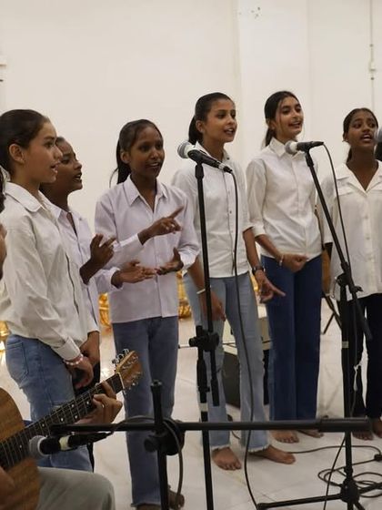 The girls from our Gully Choir performing with their music facilitator. These performances are a culmination of their weekly practice and dedication.