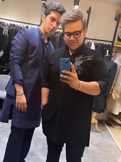 My brother Nikhil and I in our festive best. I'm wearing a blue textured Indo-western kurta set, perfect for celebrating occasions like Diwali with style.