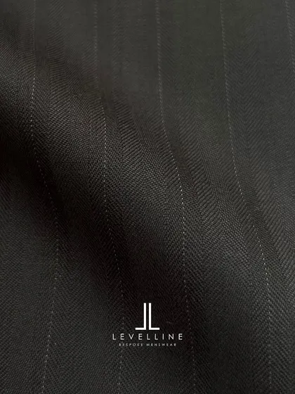 A dark charcoal pinstripe with a subtle herringbone weave, adding a layer of texture and sophistication.
