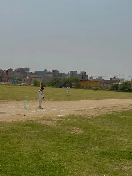 A batsman at the crease, focused on the chase during the final.