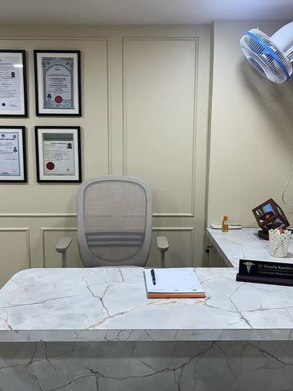 A view of my consultation desk, where every patient journey begins. It is a clean, organized space for focused and private dermatological discussions.