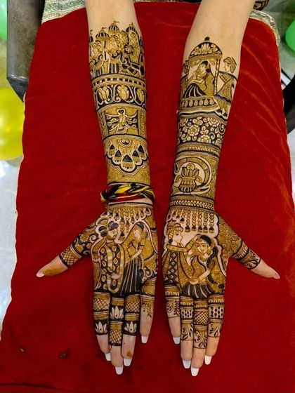 A beautiful depiction of a wedding, with a doli scene, a couple's portrait, and other ceremonial elements filling the arms.