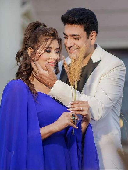 A tender moment between the couple. The makeup is soft and romantic, perfect for capturing these intimate feelings.