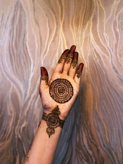 A clear, still image of a finished mandala and bracelet design. This is a timeless and elegant choice for festivals like Karva Chauth, Eid, or Diwali.