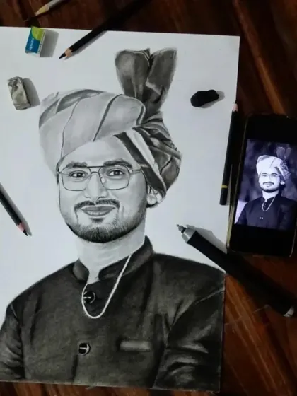 This A4 sketch of a man in a traditional Rajasthani turban was a commission from Rajasthan. The final piece is shown here with the reference photo and my tools.