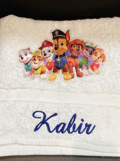 A close-up of our Paw Patrol towel, showing the high-quality printed patch and the neat embroidery of the name.