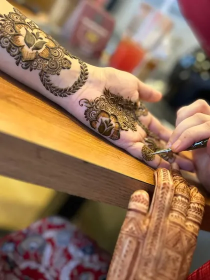 Focusing on the delicate details on the fingers. Each part of the hand gets special attention.