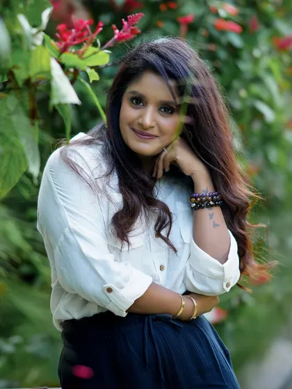 A lovely outdoor portrait of a woman with a gentle smile, surrounded by nature. These sessions are all about capturing your natural beauty.