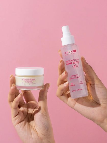 A simple and relatable hand model shot. Holding the two products together shows how they can be used as part of a routine, while the clean pink background keeps the image bright and on-brand.